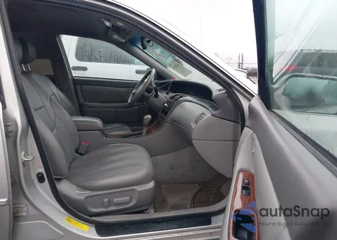 2001 Toyota Avalon Xls z USA, uszkodzony, nr VIN 4T1BF28B31U177074